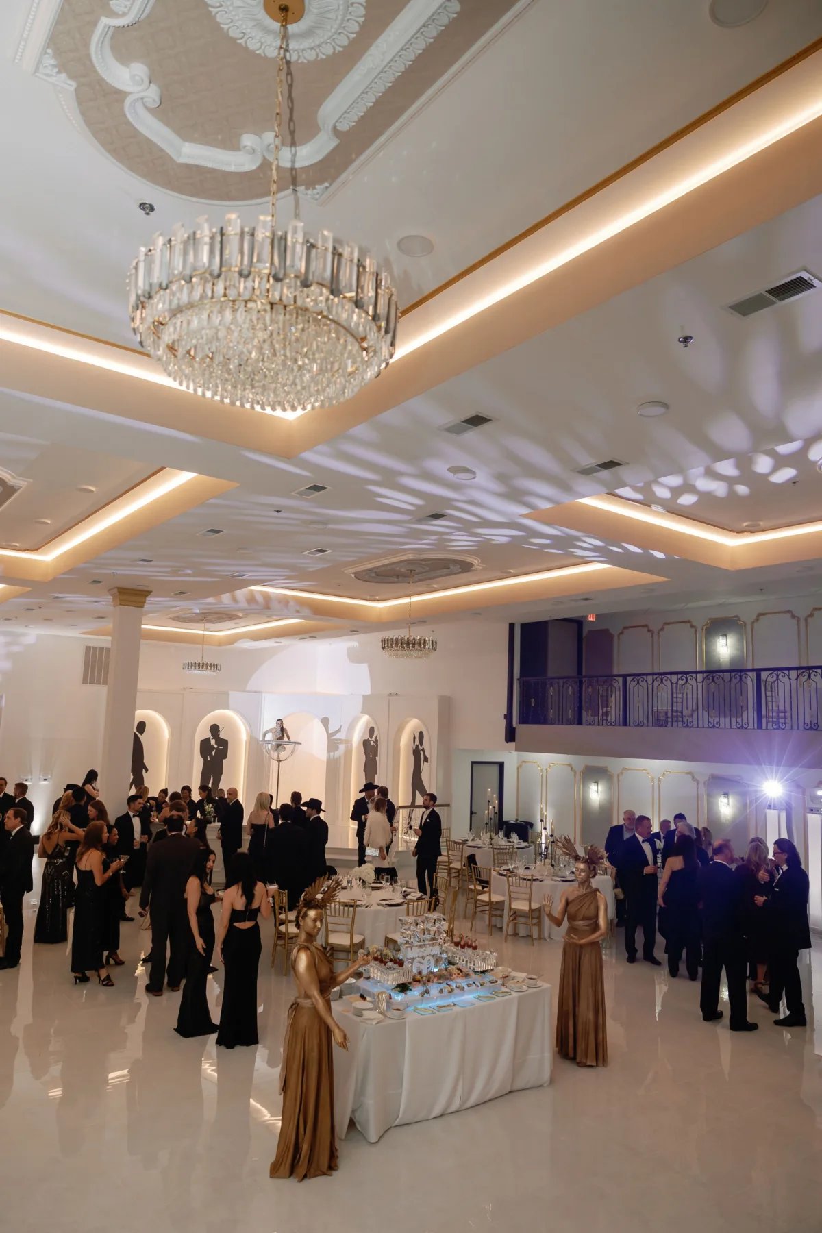 Elegant wedding reception in luxury ballroom with crystal chandelier and formal dining setup by Nashville caterer A Catered Affair