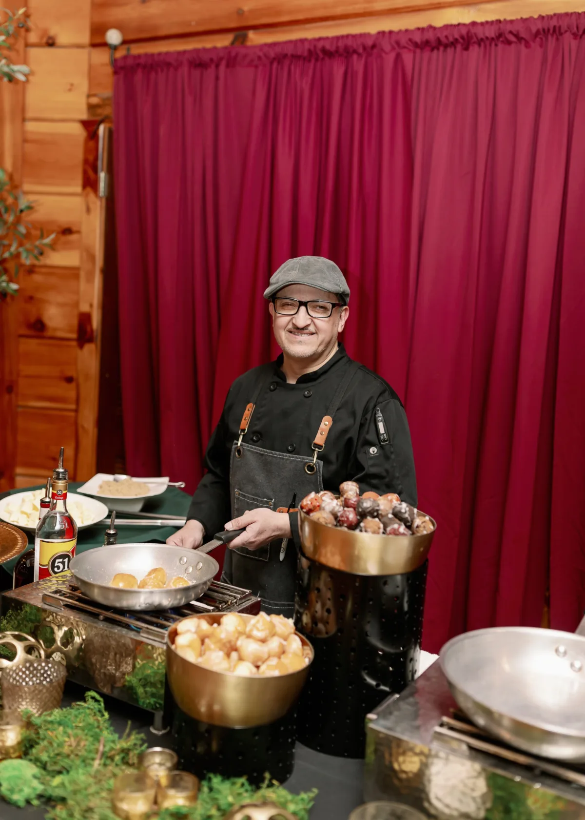 Professional chef from A Catered Affair preparing gourmet wedding cuisine during live cooking demonstration at Nashville wedding venue