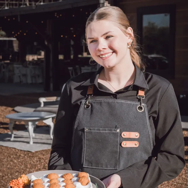 Professional server from A Catered Affair presenting elegant appetizers at Nashville wedding venue