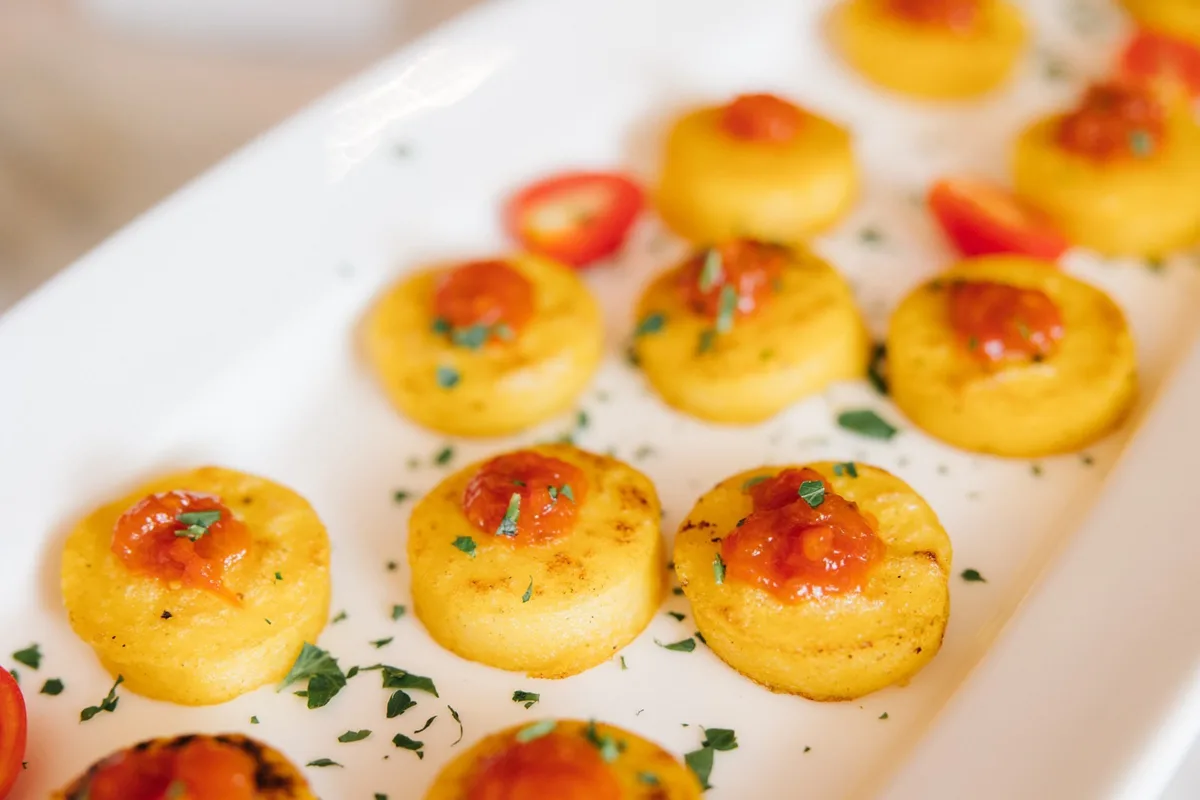 Elegant savory appetizers with roasted tomatoes and herbs served by Nashville wedding caterer A Catered Affair
