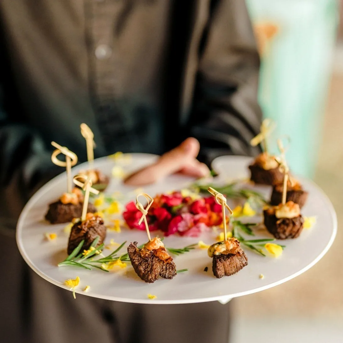 Elegant beef tenderloin appetizer skewers with garnish served by A Catered Affair Nashville wedding catering