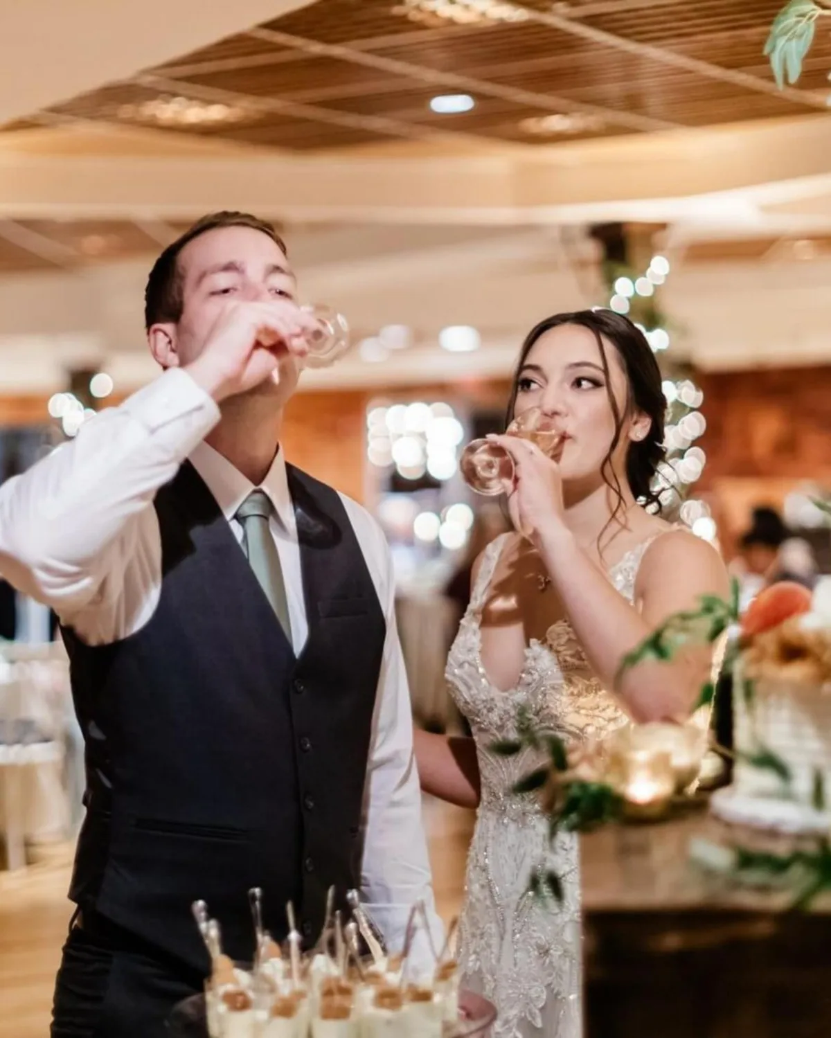 Bride and groom enjoying champagne toast at Nashville wedding reception catered by A Catered Affair