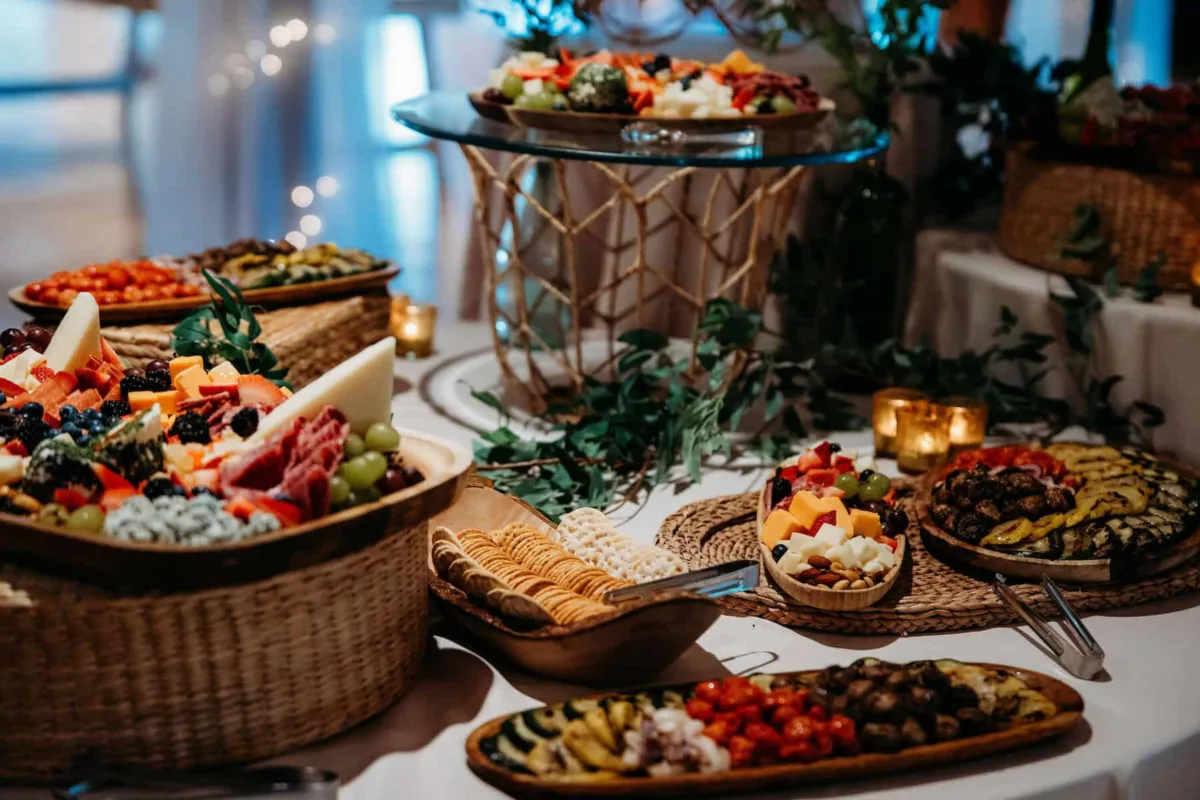 Elegant wedding charcuterie and appetizer display by A Catered Affair Nashville wedding catering featuring artisanal cheese boards, crackers, and gourmet appetizers