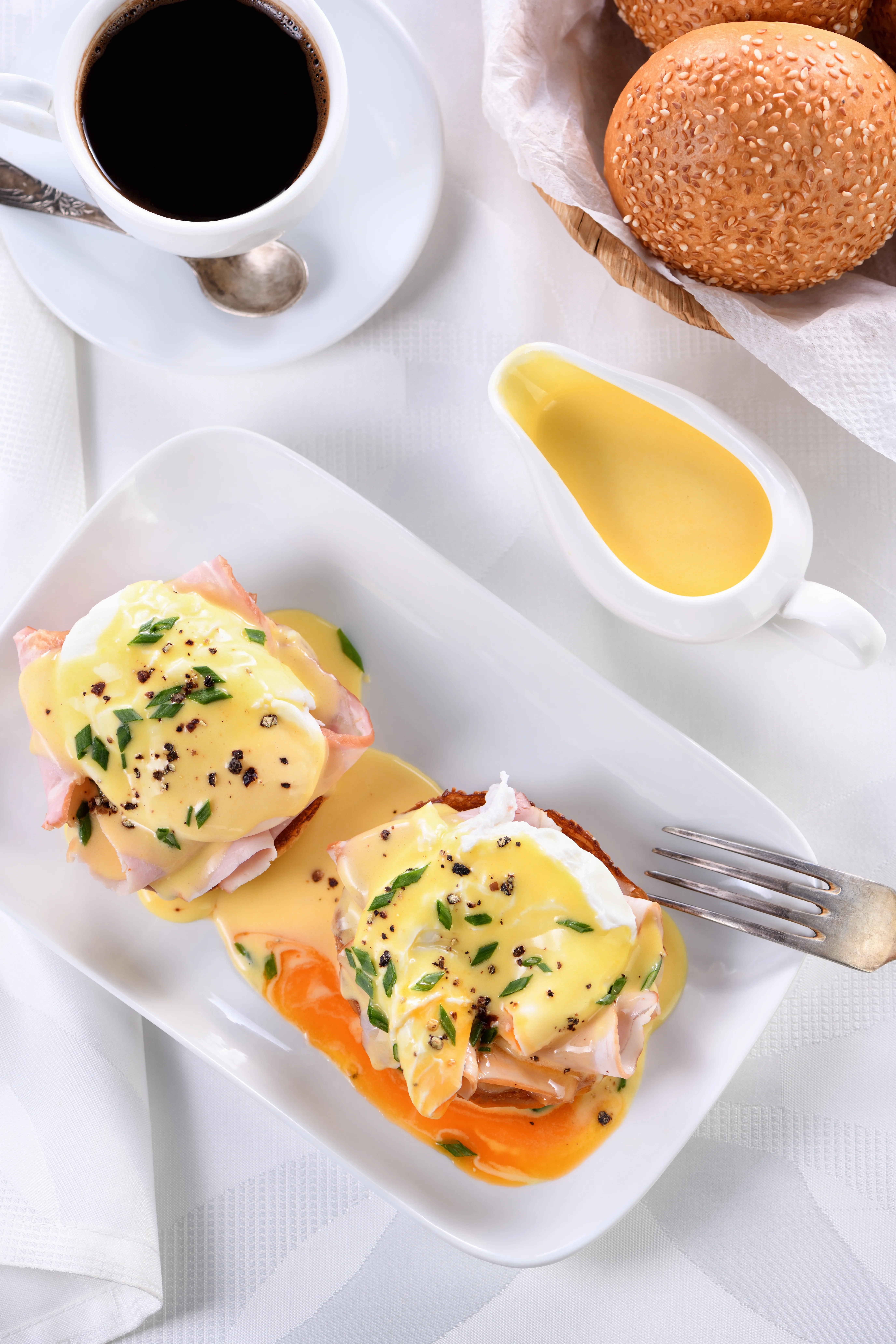 Eggs Benedict with coffee and breakfast buns by A Catered Affair Nashville catering.