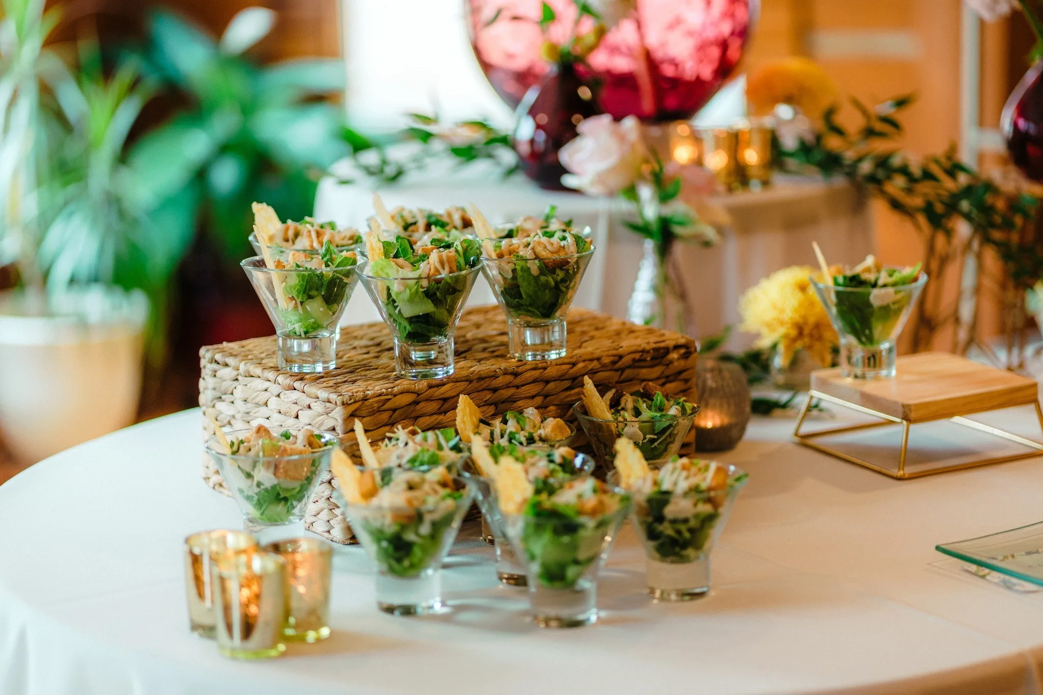 Elegant individual salad appetizers in martini glasses with crispy garnishes by Nashville wedding caterer A Catered Affair
