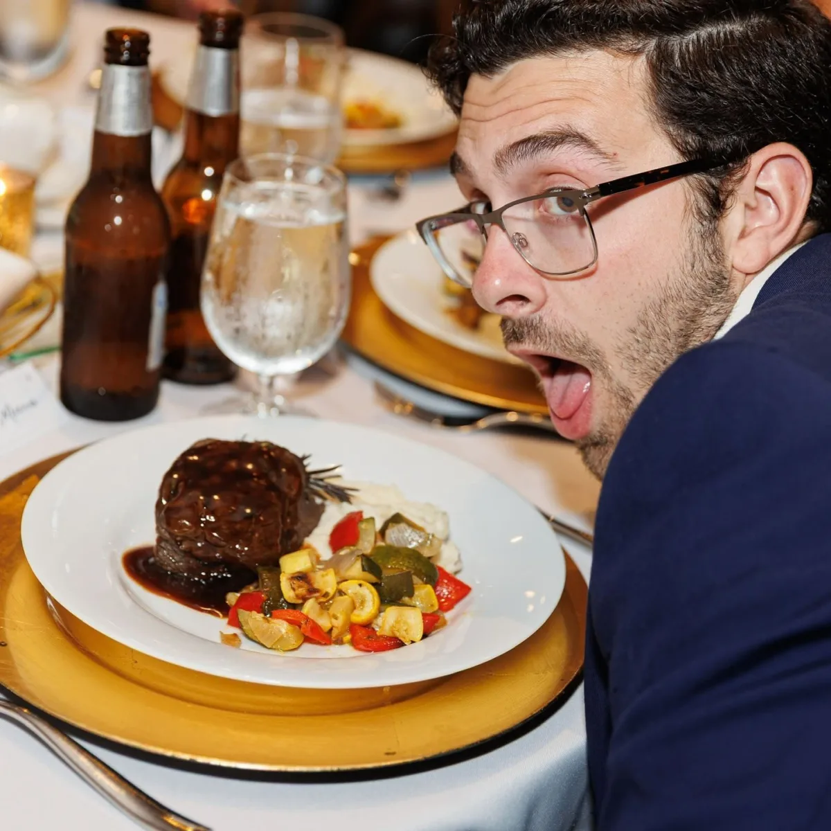 Elegant plated dinner with glazed meat and roasted vegetables served by Nashville wedding caterer A Catered Affair
