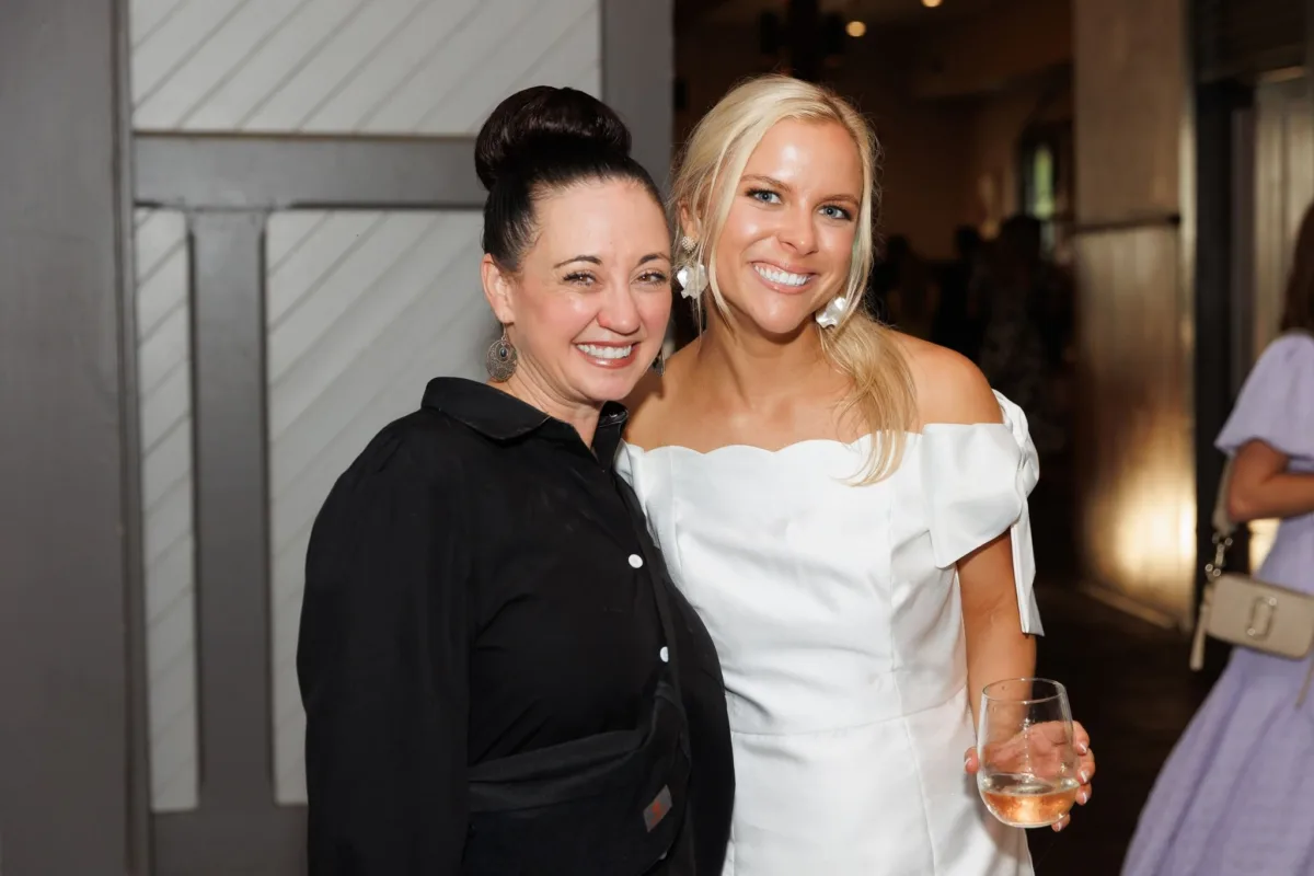 Two wedding guests celebrating at Nashville wedding reception catered by A Catered Affair