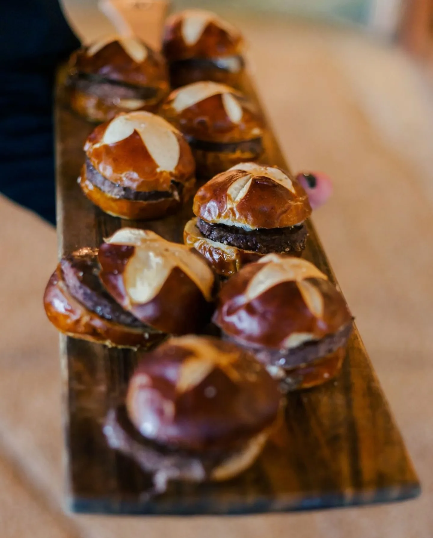 Mini slider appetizers served on wooden board by A Catered Affair Nashville wedding catering