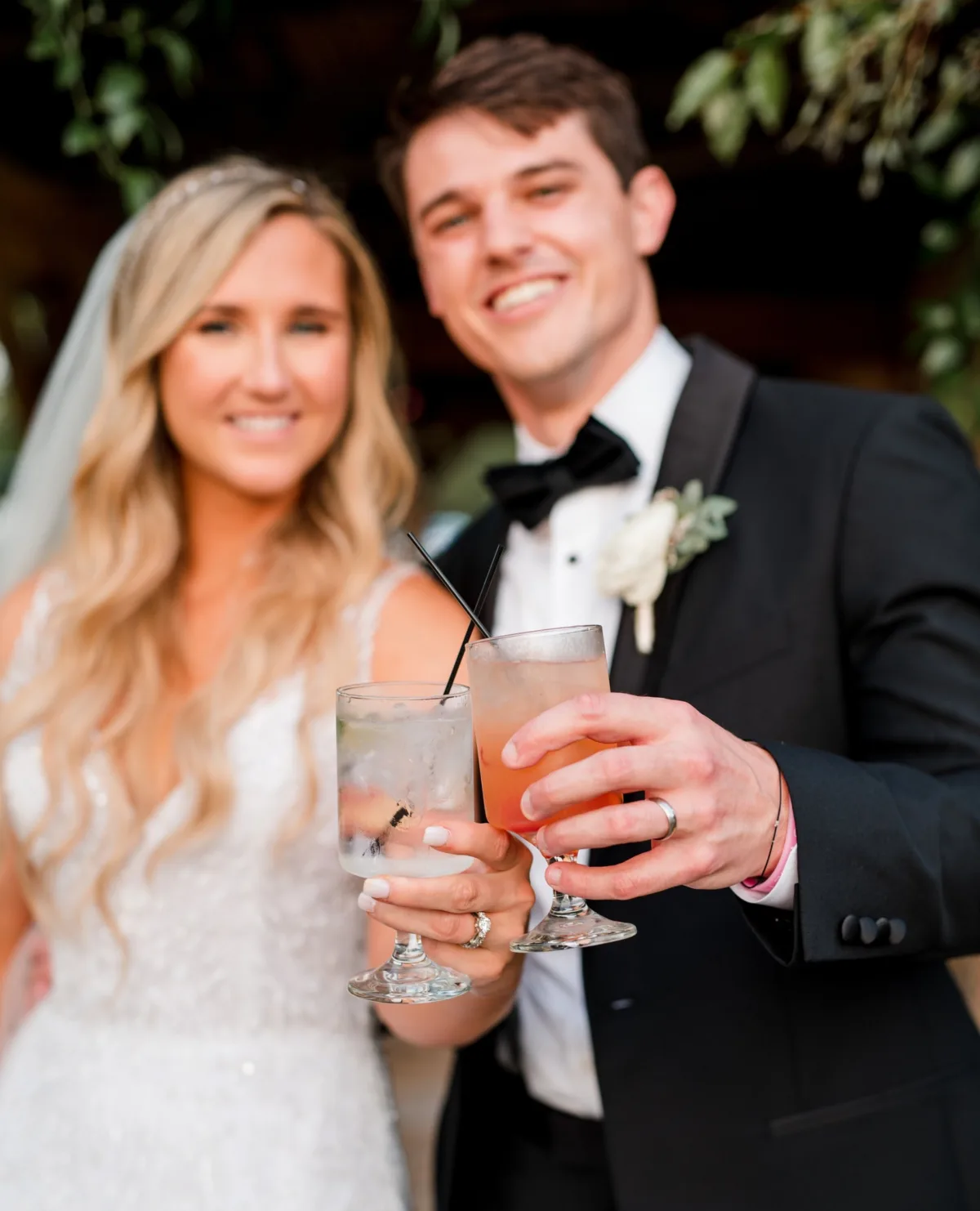 Newlyweds toast with signature cocktails during their Nashville wedding reception catered by A Catered Affair