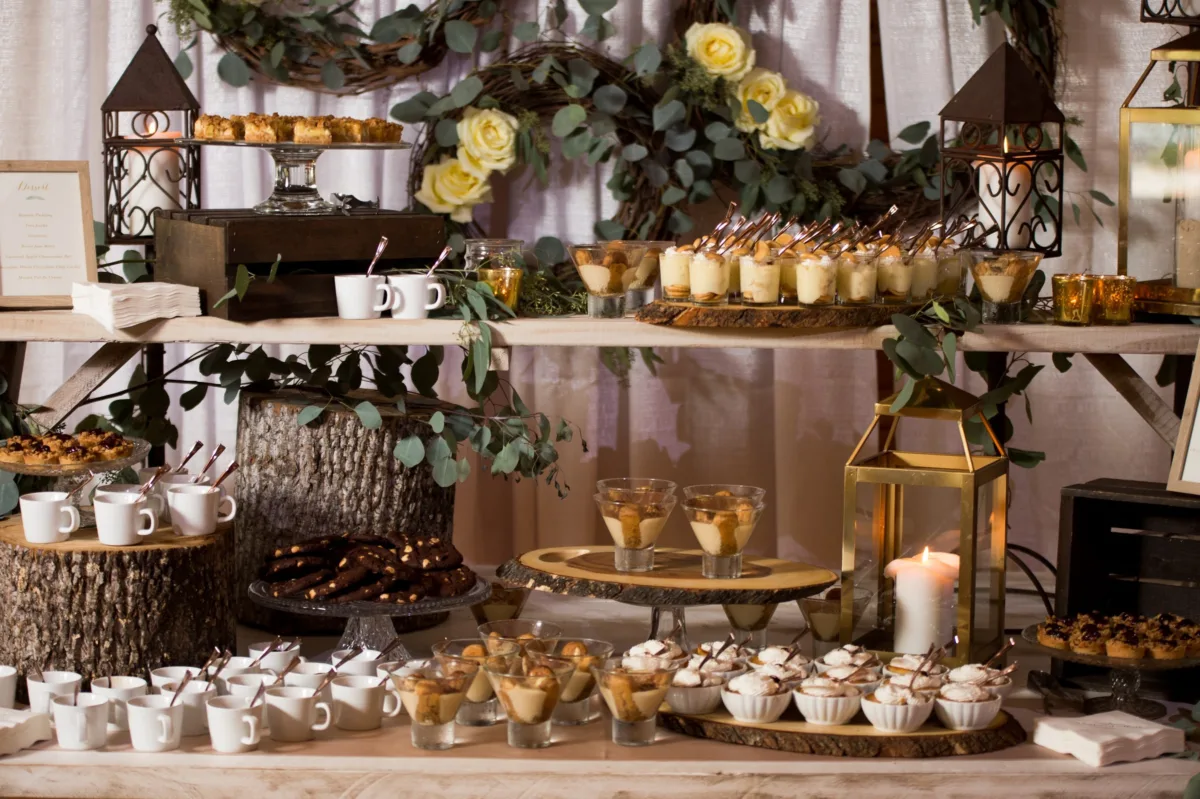 nashville wedding dessert table catered affair rustic elegant - Desserts Rustic elegant wedding dessert table with tiered displays, lanterns, and floral garland by Nashville caterer A Catered Affair