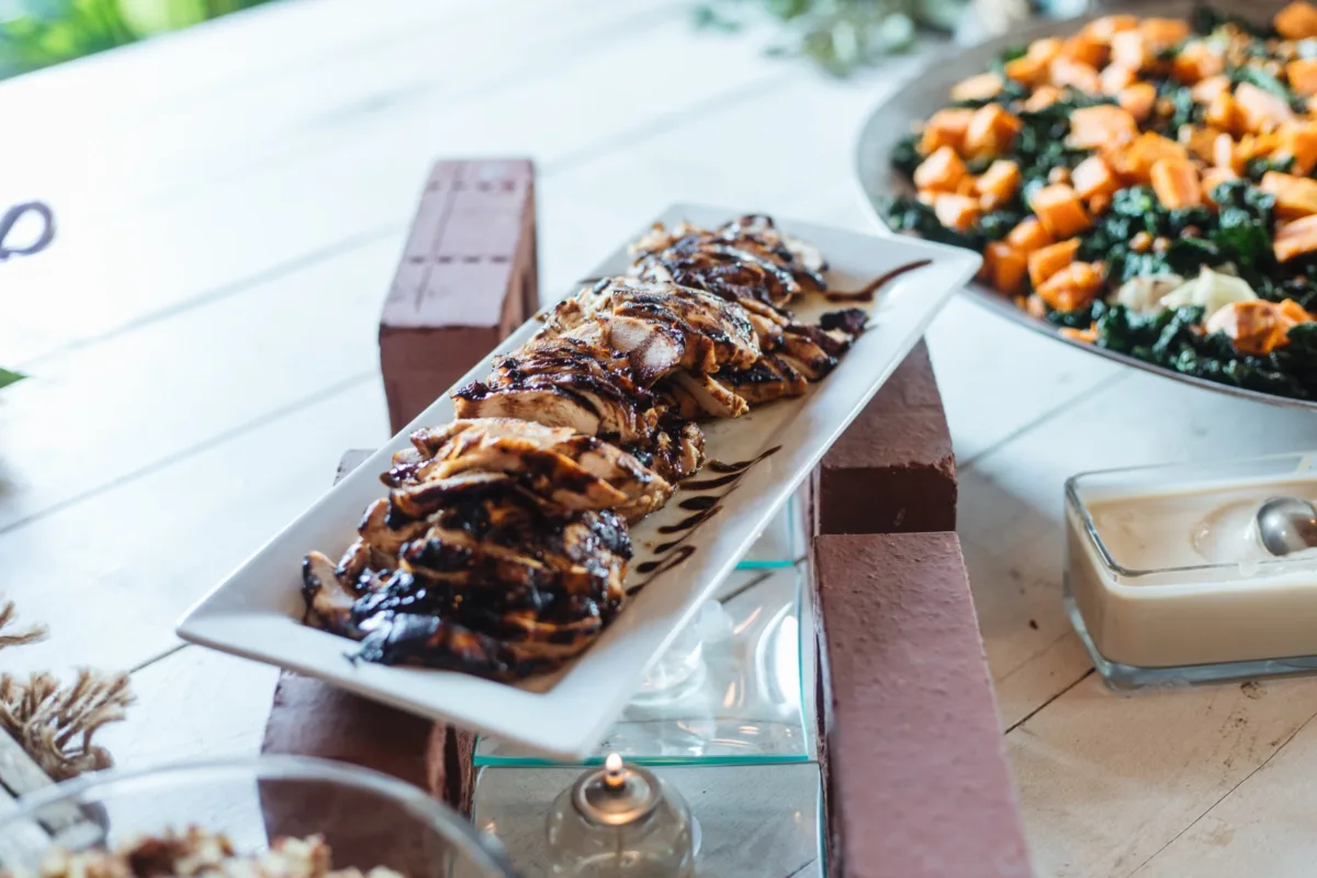 Elegant wedding buffet display featuring chocolate desserts and fresh salad by A Catered Affair Nashville wedding catering